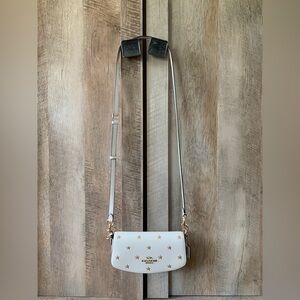 Coach purse with embroidered gold star detail